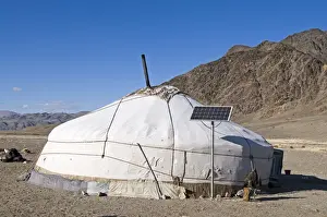 Mountain Prints: Nomads Ger with Golden Eagle and Solar Panel outside near Bayan-Uglii in Altai Mountains