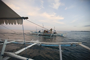 Outriggers off Sabang on route to the Puerto Princesa Subterranean River National Outriggers off Sabang on route to the Puerto Princesa Subterranean River National