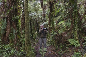 Photographer David Tipling in montane forest at 3000m near Mt Hagen in Western Highlands Photographer David Tipling in montane forest at 3000m near Mt Hagen in Western Highlands