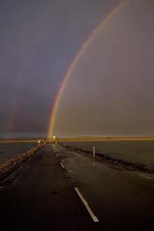 Rainbow over Lindisfarne causeway Holy Island Northumberland autumn Rainbow over Lindisfarne causeway Holy Island Northumberland autumn