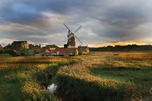 Trending: Reedbed and Cley Mill at Cley North Norfolk on a stormy evening in October