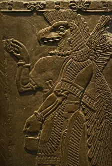 Birds And People Prints: Sculptured wall relief depicting an Eagle headed protective Spirit from Temple of