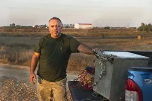 Cyprus Prints: Seargeant Kyriacos Elia from Sovereign Base Area Police at Deleleia with seized illegal