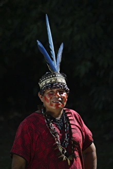 Shamans assistant from Bora Tribe wearing Macaw feather head dress Northern Amazon Shamans assistant from Bora Tribe wearing Macaw feather head dress Northern Amazon