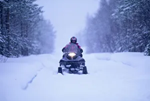Snow mobile on Finnish track near Ivalo in Finnish Lapland Finland winter Snow mobile on Finnish track near Ivalo in Finnish Lapland Finland winter