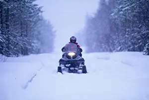 Trending: Snow mobile on Finnish track near Ivalo in Finnish Lapland Finland winter