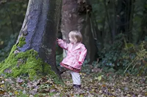 Toddler Prints: Toddler (2yr old girl) exploring in woodland Norfolk autumn