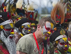 Tourist joining in a Sing-sing at Hagen Show Western Highlands Papua New Guinea Tourist joining in a Sing-sing at Hagen Show Western Highlands Papua New Guinea