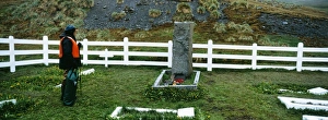 Tourist at Shackletons Grave, Grytviken, South Georgia