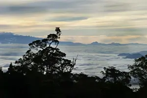 View from Magic Mountain Lodge across cloud covered valley towards Mt Hagen in Western