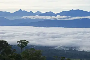 Pacific Prints: View from Magic Mountain Lodge across cloud covered valley towards Mt Hagen in Western