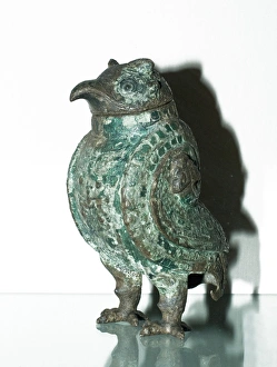 Wine vessel in the shape of an owl dating back to the Shang Dynasty in China 1250-1055 BC Wine vessel in the shape of an owl dating back to the Shang Dynasty in China 1250-1055 BC