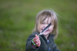 People Prints: Young girl holding birds feather Norfolk spring