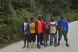 Young men posing for picture on Highlands Highway in Southern Highlands Papua New Guinea Young men posing for picture on Highlands Highway in Southern Highlands Papua New Guinea