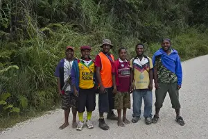 Papua New Guinea Prints: Young men posing for picture on Highlands Highway in Southern Highlands Papua New Guinea