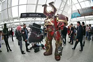 A Warhammer Chaos Space Marine dwarfs participants at MCM London Comic Con at Excel